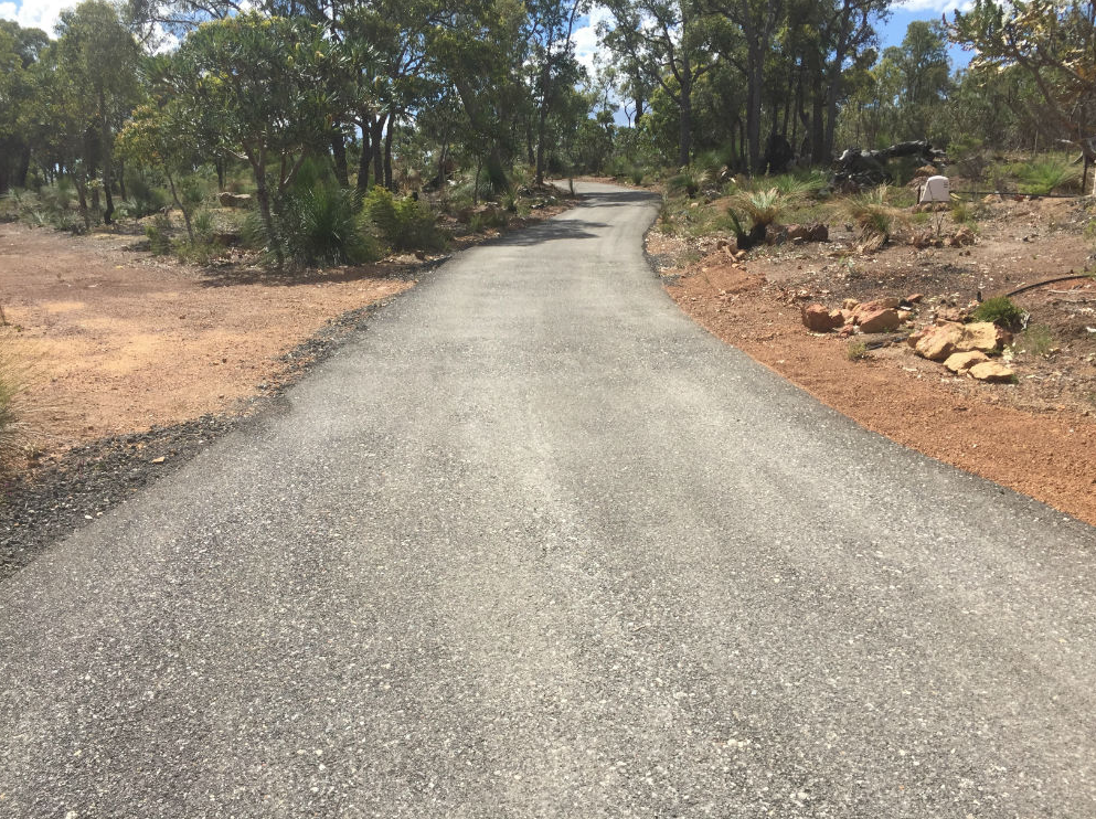 This is a photo of a hot spray & seal bitumen driveway which is in the process of being installed by Bannockburn Road Tech